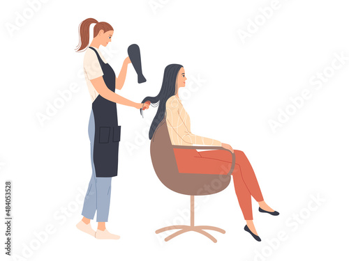 The hairdresser styles the hair and dries it with a hair dryer.