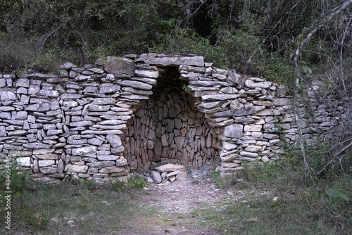 Dry stone shelter near Calvisson, Gard, South of France photo