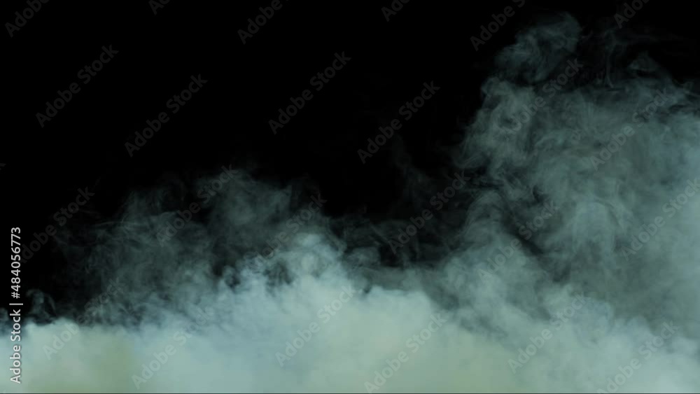 Abstract white smoke in slow motion. Smoke, Cloud of cold fog in light spot background. Light, white, fog, cloud, black background, 4k, ice smoke cloud. Floating fog. Abstract white smoke in slow motion. Smoke, Cloud of cold fog in light spot background. Light, white, fog, cloud, black background, 4k, ice smoke cloud. Floating fog.