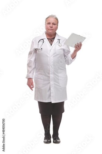 Serious medical doctor woman with tablet computer.