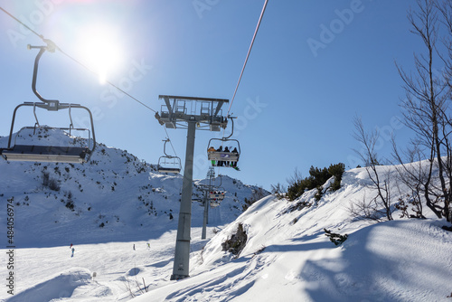 chairlift at mountain ski resort on sunny day © chechotkin