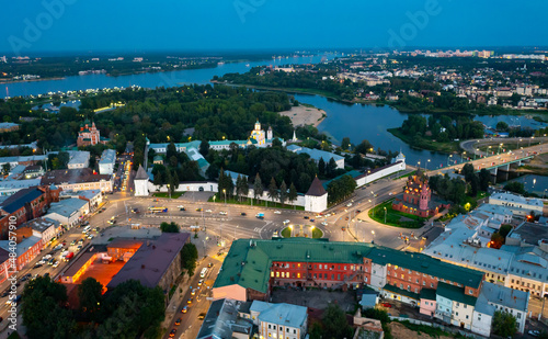 Cityscape of Yaroslavl with view of Transfiguration Monastery and Epiphany Church in evening.