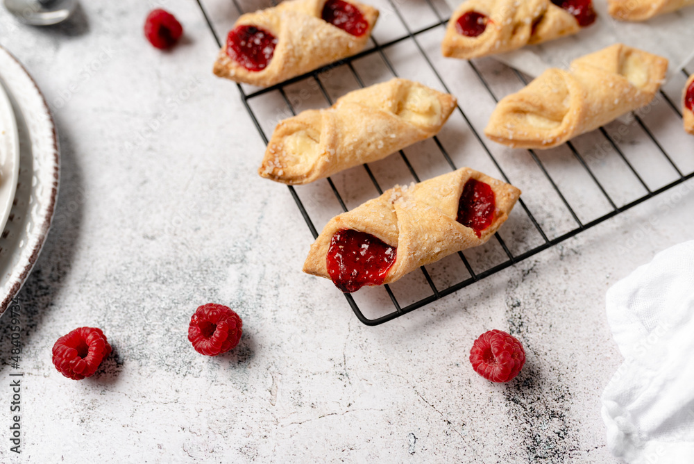 Kolacky with Cream Cheese and Raspberry. Pastry with jelly and cream. Polish Kolaczki cookies, freshly baked Kolacky with Cream Cheese and Raspberry. Pastry with jelly and cream. Polish Kolaczki cookies, freshly baked
