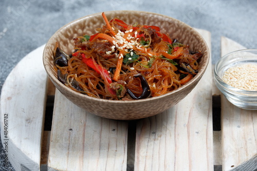Korean authentic cuisine, Japchae or glass noodles stir fried with vegetables © Edy