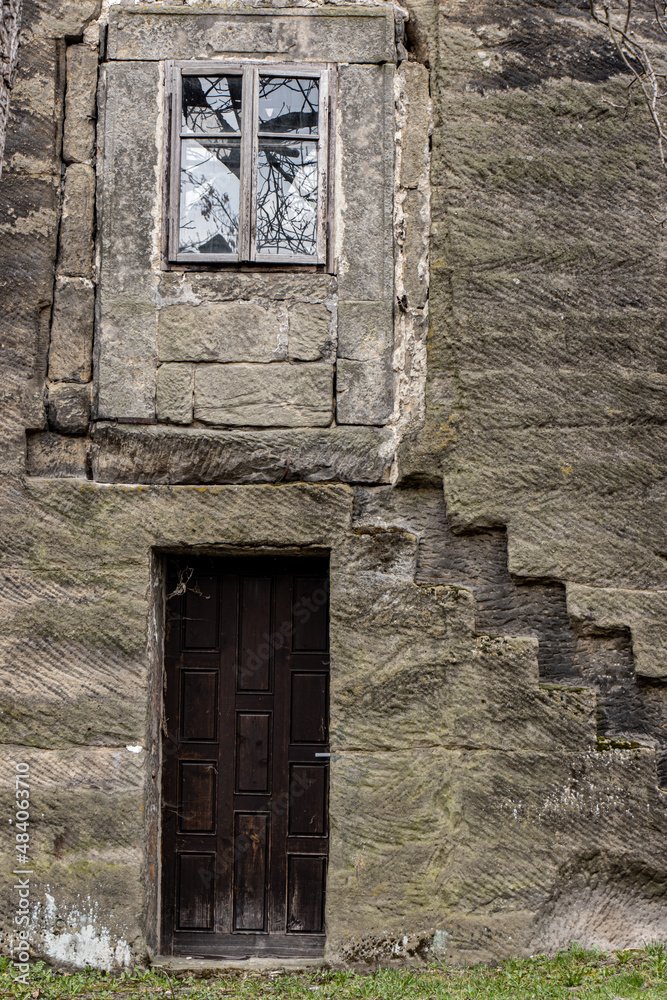 A entrance in stone wall of the historical haunted building known as the House of Alchemist, according to folk chronicles a sorcerer lived here. A entrance in stone wall of the historical haunted building known as the House of Alchemist, according to folk chronicles a sorcerer lived here.
