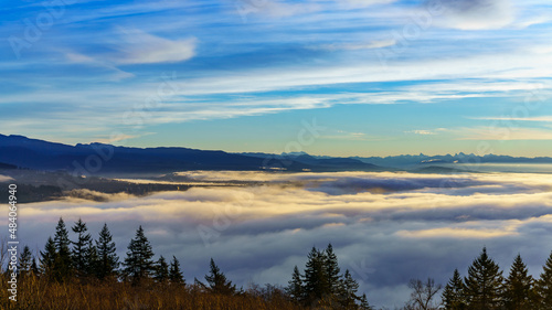 Dramatic cloud inversion over Fraser Valley, BC, as viewed from community of Univercity Highlands on Burnaby Mountain