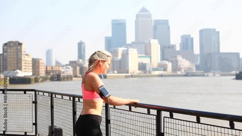 Woman doing stretching exercises after training Woman doing stretching exercises after training