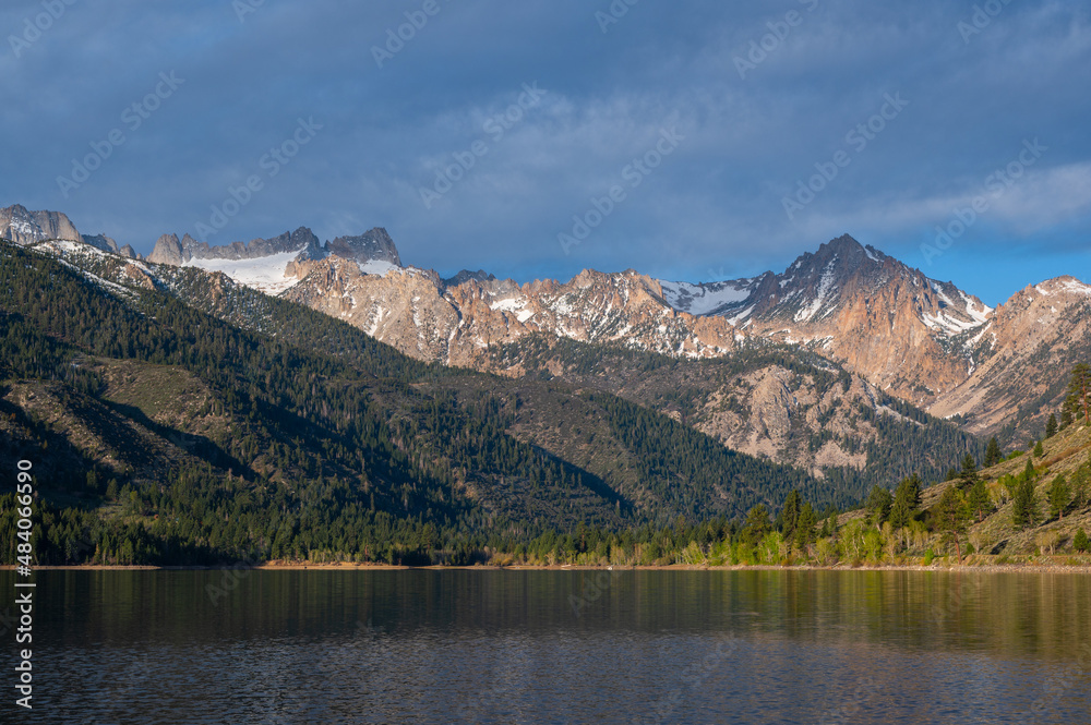 Panoramic view of Yosemite mountains from nearby lake.