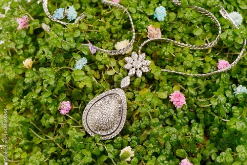 Women's platinum pendant with diamonds on a preciouse golden necklace