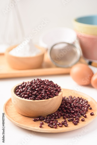 Azuki bean and wheat flour on white background. Natural organic products, healthy baking ingredients