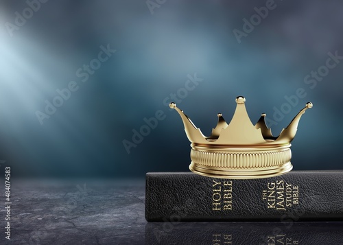 The Holy Bible and a Kings Crown on a desk