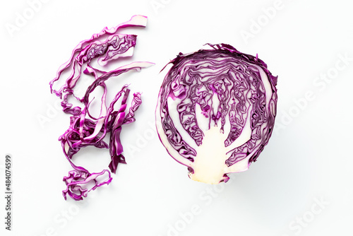 Fototapeta Cross section view of a purple cabbage with shavings of cabbage to the side