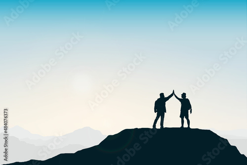 Silhouette group of people congratulating success on top of mountain. Sky background. Teamwork  target and goal concept. 