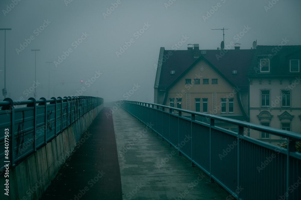pedestrian  paths on the bridge in the fog