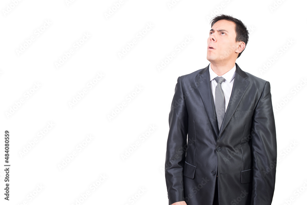 Hesitant man in suit standing in studio Hesitant man in suit standing in studio