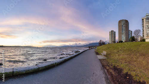 Seawall in Downtown Vancouver  British Columbia  Canada. Colorful Winter Sunset. Modern City on the Pacific Ocean West Coast.