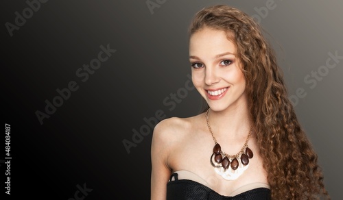 Portrait of smiling dreamy young female enjoy party