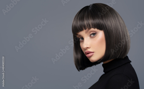 Fotobehang Portrait of a beautiful girl with short black hair.