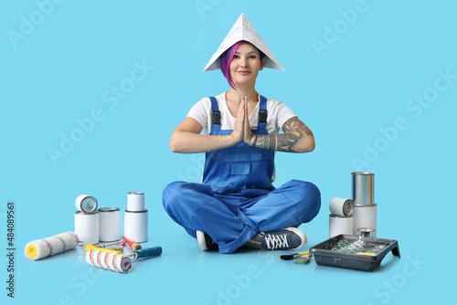 Female painter in paper hat...
