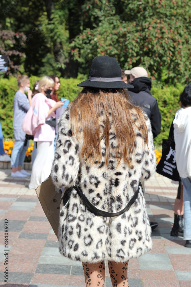 Woman dressed in coat with leopard print Woman dressed in coat with leopard print