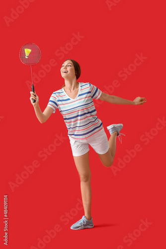 Sporty female badminton pla...