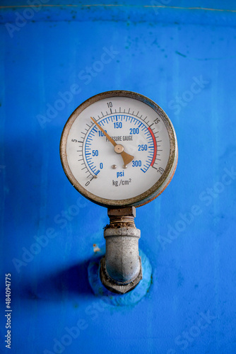Pressure gauge (Pressure measurement) is measured by taking a reading from the dial. Industrial equipment, old rusted items that have been used.