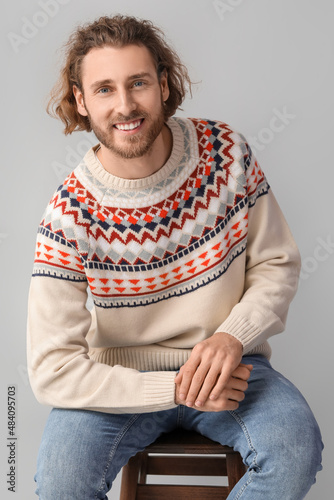 Handsome young man in knitt...