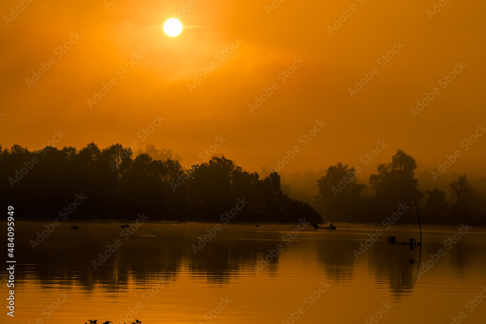 The background of the sea by the evening sea, with natural beauty (sea water, rocks, sky) and fishermen are fishing by the river bank, is a pleasure during travel.