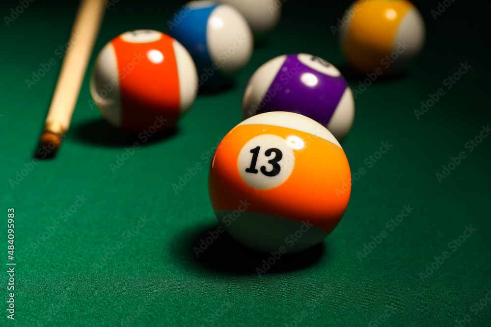 Different billiard balls on green table Different billiard balls on green table