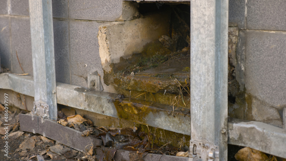 Photo of broken facade of the house by vandals Photo of broken facade of the house by vandals