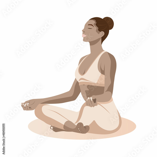 African-american yoga girl in lotos pose, in beige clothes, sitting 