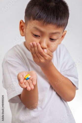 boy does not want to take pills