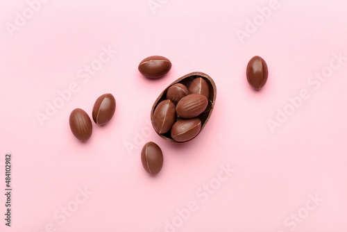 Chocolate Easter eggs on pink background © Pixel-Shot