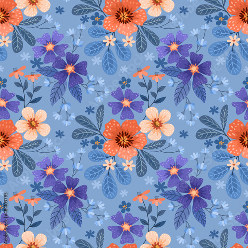 Colorful hand draw flowers on blue background seamless pattern.