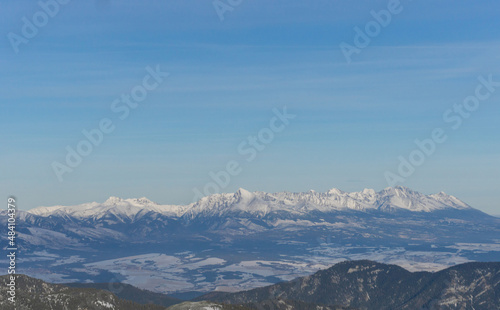 Thick white snow covered mountain top with maintain ranges landscape background in winter