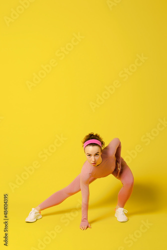 Workout. Athletic Young Woman Doing Exercises Over Yellow Studio Background. Copy Space