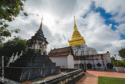The Gold stupa with the old stupa at Wat Phra That Chang Kham Worawihan or Phrathat Chang Kham Worawihan temple is the one attraction and has famous of Nan province, Thailand