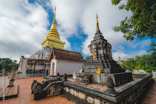 The Gold stupa with the old stupa at Wat Phra That Chang Kham Worawihan or Phrathat Chang Kham Worawihan temple is the one attraction and has famous of Nan province, Thailand