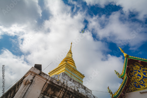 Wat Phra That Chang Kham Worawihan or Phrathat Chang Kham Worawihan temple is the one attraction and has famous of Nan province  Thailand  Has the airplane passed on the sky 