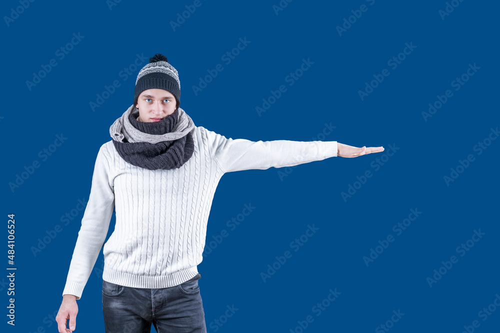 White man in hat and scarf with outstretched hand White man in hat and scarf with outstretched hand