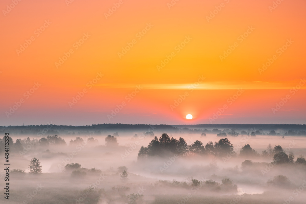 Amazing Sunrise Sunset Over Misty Landscape. Scenic View Of Foggy Morning Sky With Rising Sun Above Misty Forest And River. Early Summer Nature Of Eastern Europe.Amazing Sunrise Sunset Over Misty Amazing Sunrise Sunset Over Misty Landscape. Scenic View Of Foggy Morning Sky With Rising Sun Above Misty Forest And River. Early Summer Nature Of Eastern Europe.Amazing Sunrise Sunset Over Misty
