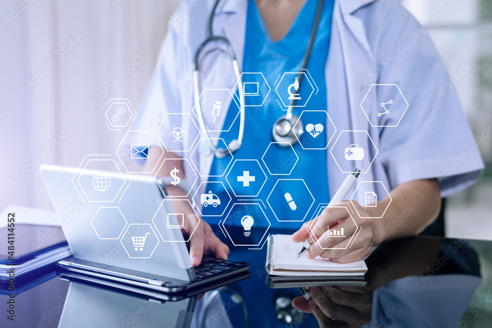medical technology concept,smart doctor hand working with modern laptop computer with his team virtual icon medical technology concept,smart doctor hand working with modern laptop computer with his team virtual icon
