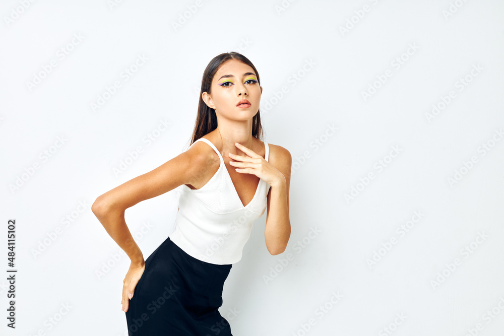 portrait pretty woman white t shirt hand gestures charm light background unaltered portrait pretty woman white t shirt hand gestures charm light background unaltered
