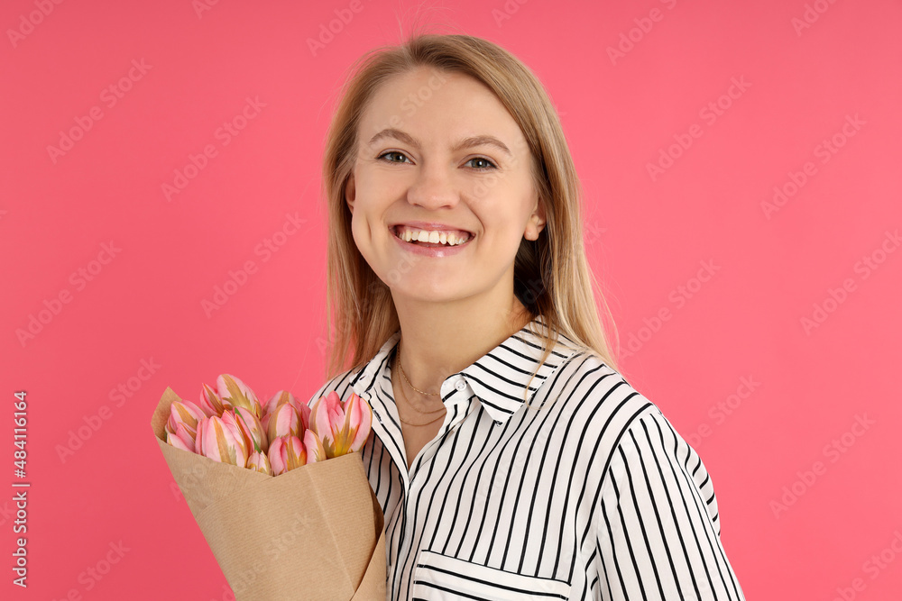Young woman with bouquet on pink background Young woman with bouquet on pink background