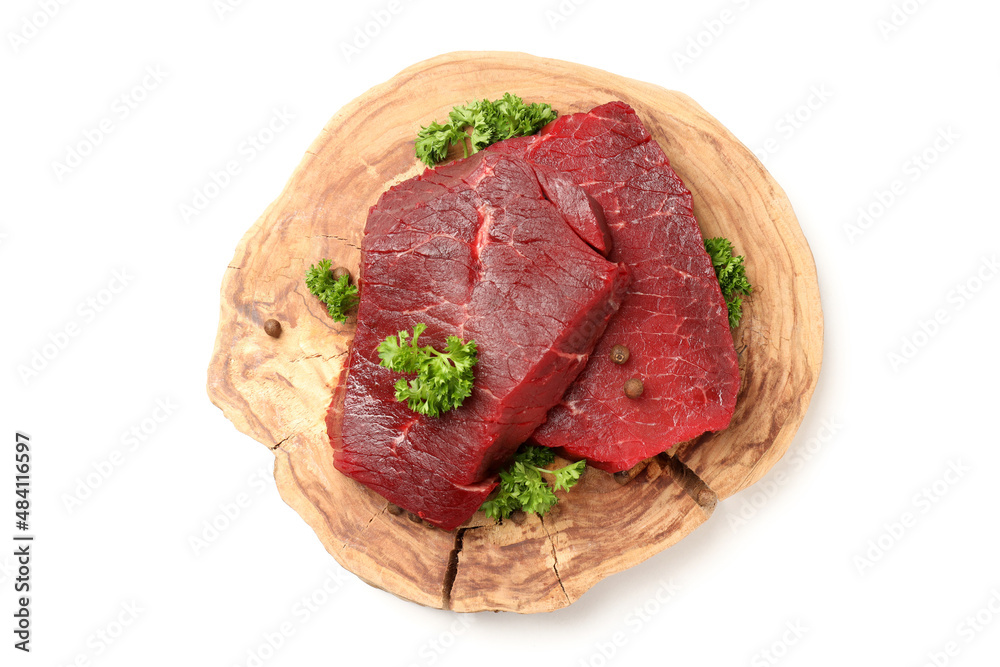 Piece of log with raw beef steaks isolated on white background Piece of log with raw beef steaks isolated on white background