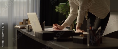 Portrait of Caucasian female businesswoman working at the desk in the office