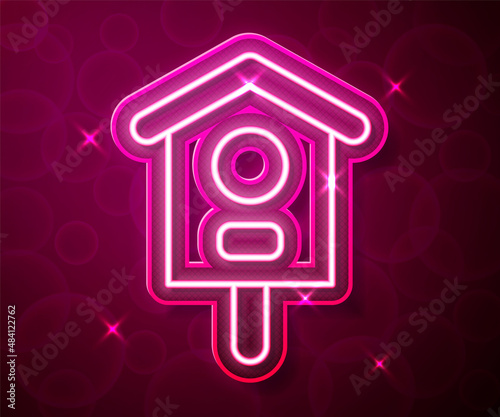 Glowing neon line Bird house icon isolated on red background. Nesting box birdhouse, homemade building for birds. Vector