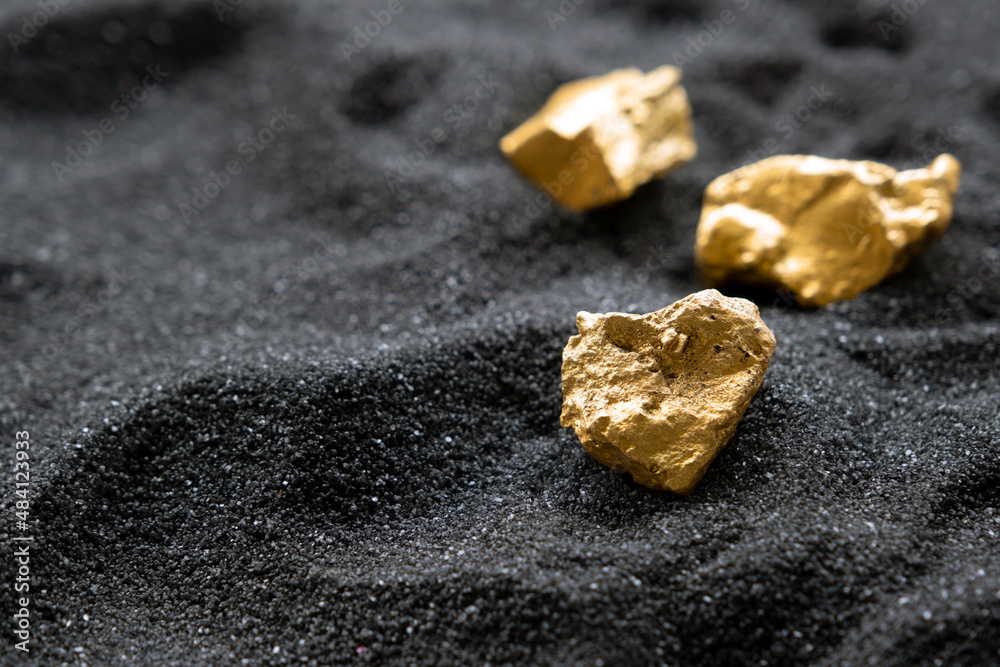 Pure gold from the mine that was unearthed was placed on the black sand