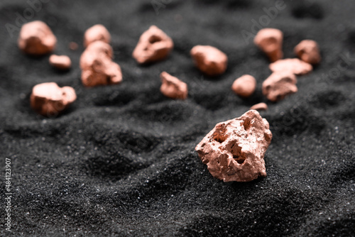Bild auf Leinwand The lumps of copper ore from the excavated mine were placed on the black sand