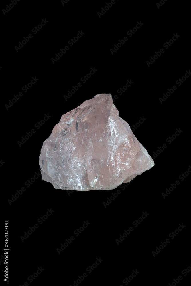 Rose quartz, mineral stone on black background.